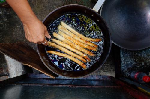 Street food being prepared by one of mother beneficiary of Family and Community Outreach Service